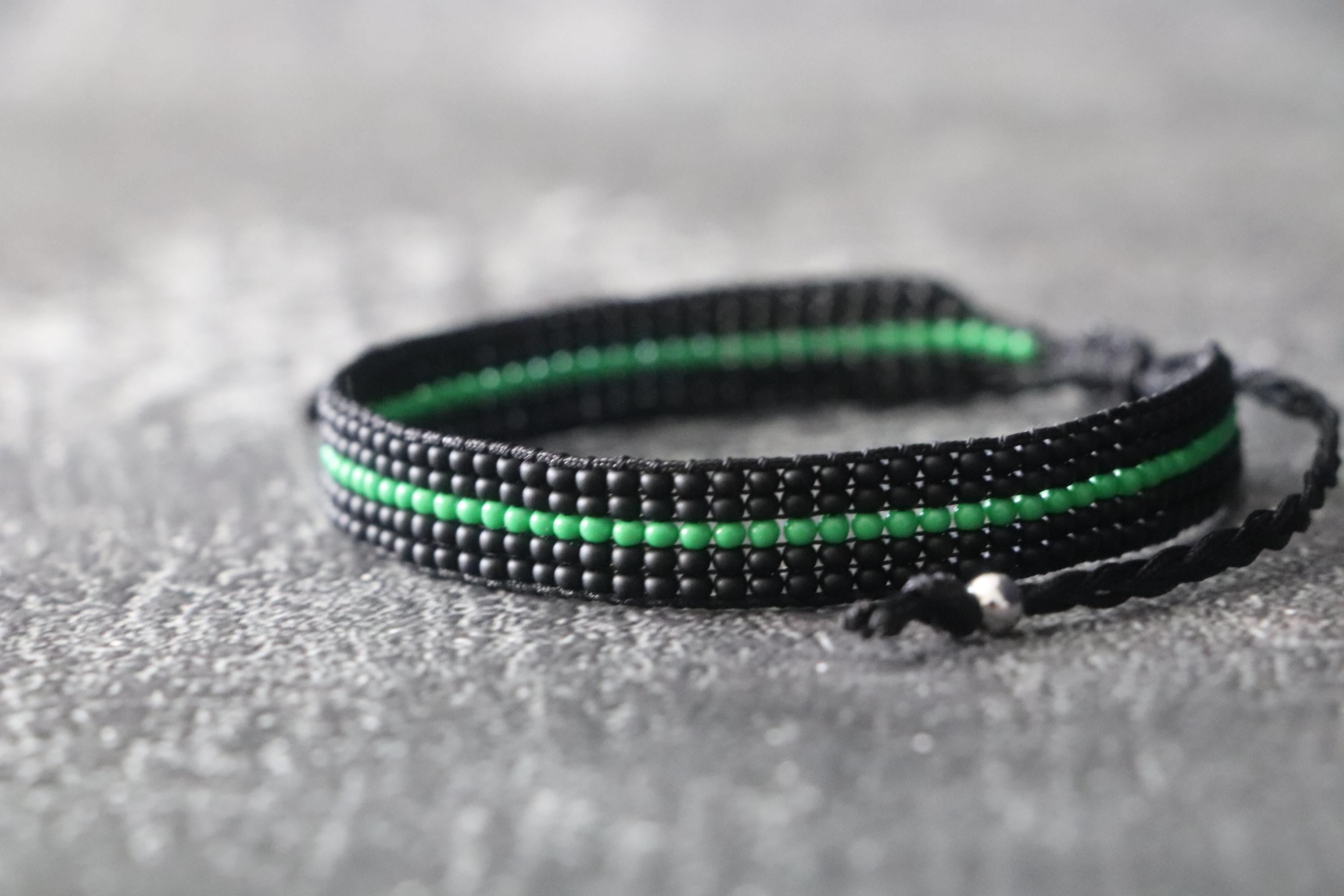 Black Bracelet with Green Line Design