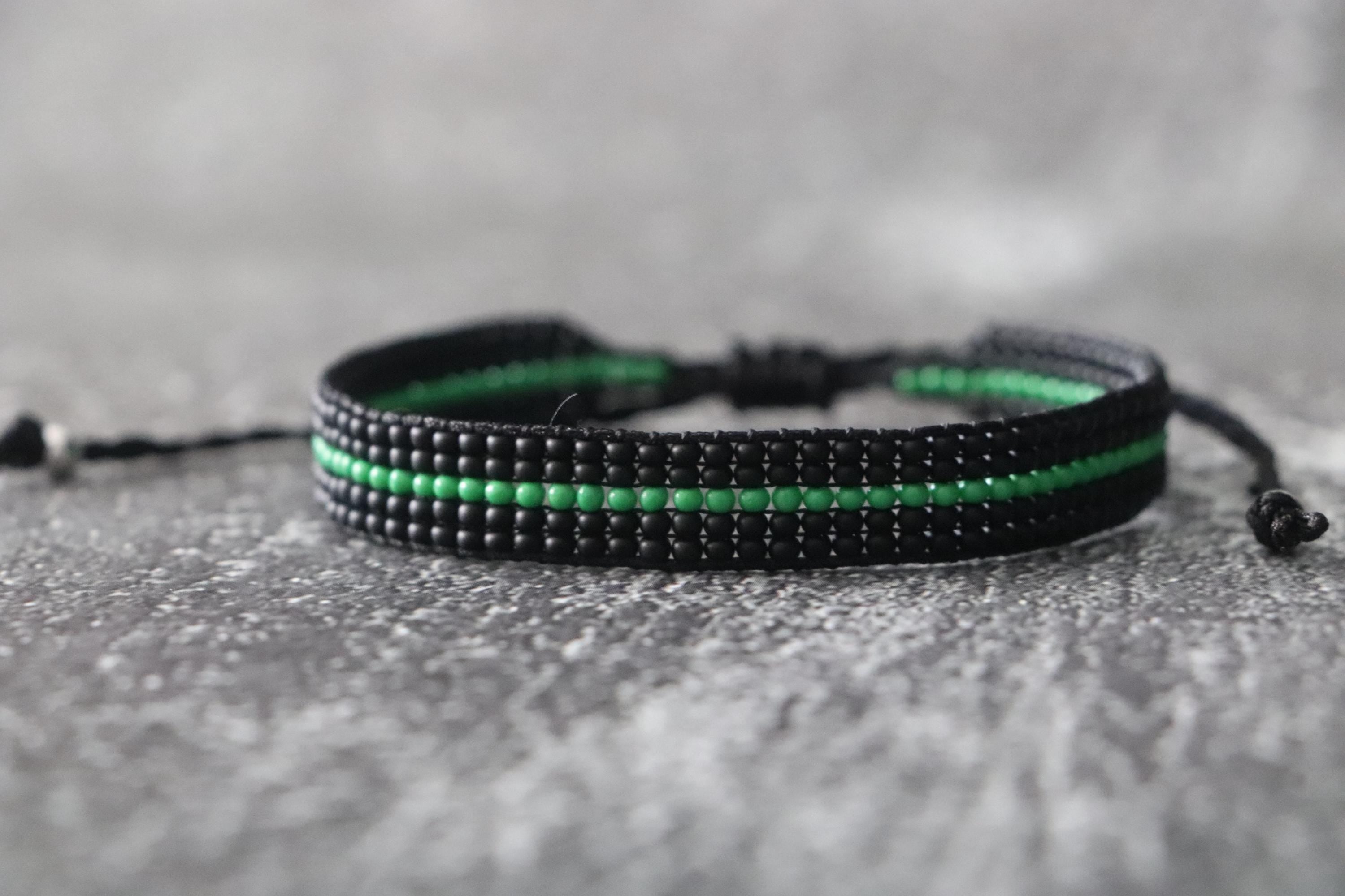 Black Bracelet with Green Line Design