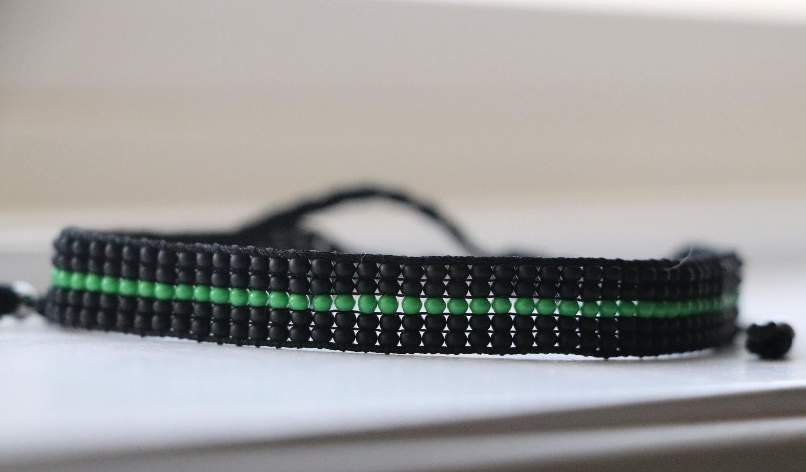 Black Bracelet with Green Line Design