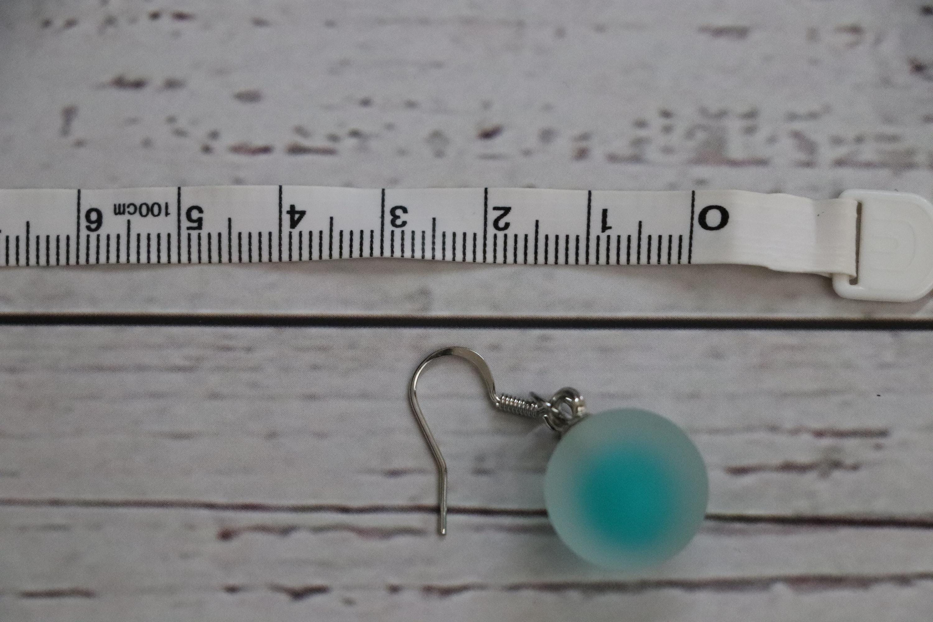 Green Dangle Ball Earrings