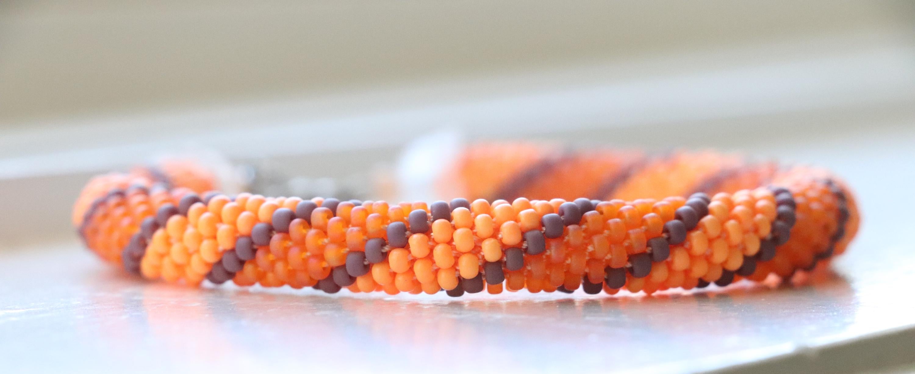 Handcrafted spiral orange bracelet