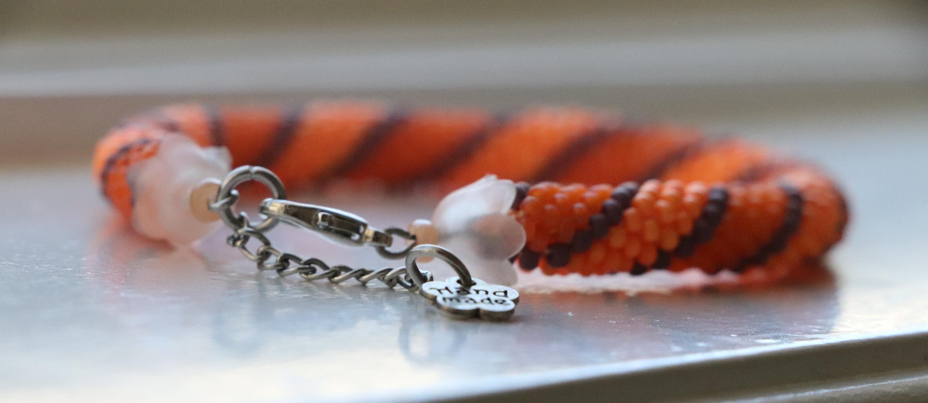 Handcrafted spiral orange bracelet