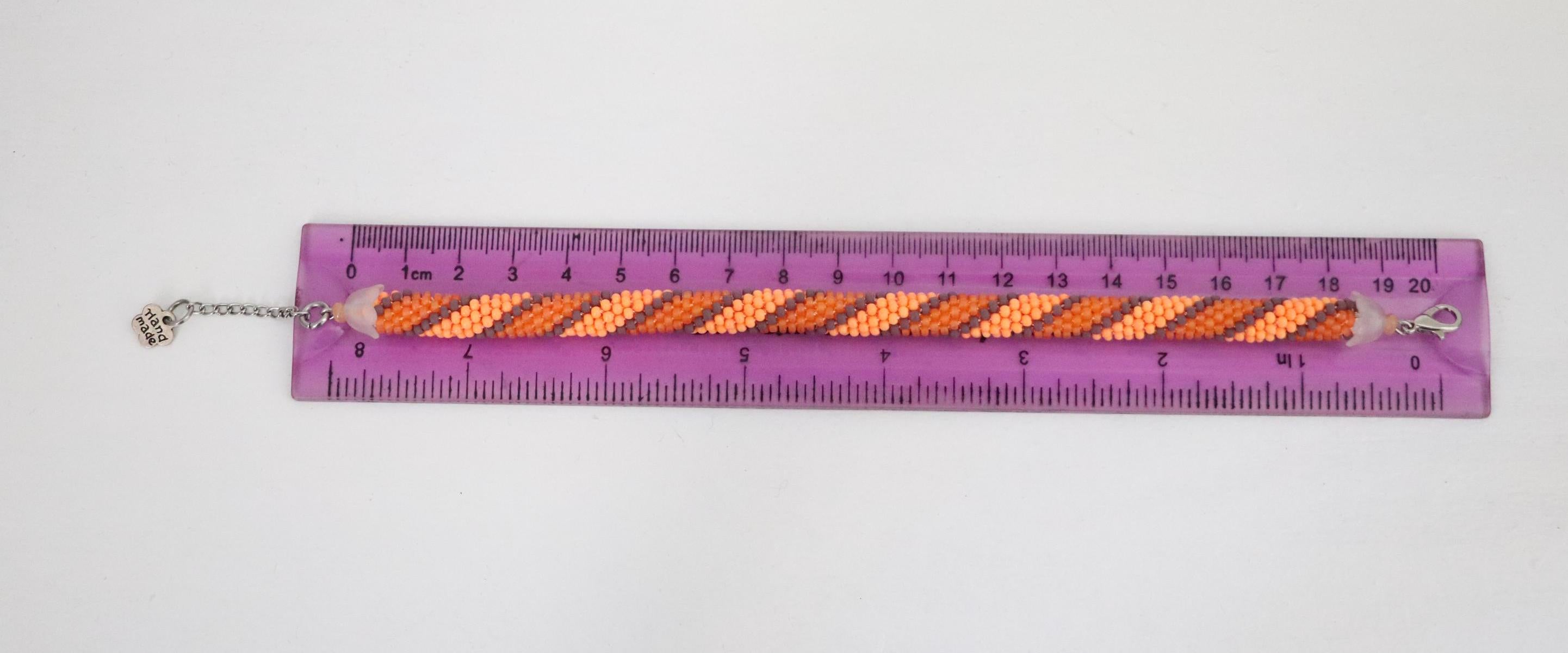 Handcrafted spiral orange bracelet